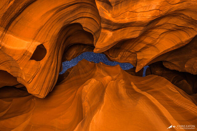 The night sky full of stars seen through the opening of Antelope Canyon.