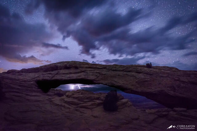 A night time thunderstorm is seen through Mesa Arch in Canyonlands National Park,