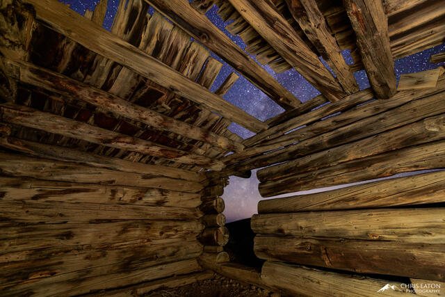 A dilapidated mining cabin at 10,000 feet elevation in the Ancient Bristlecone Pine Forest offers a stunning view of the night sky and the Milky Way.