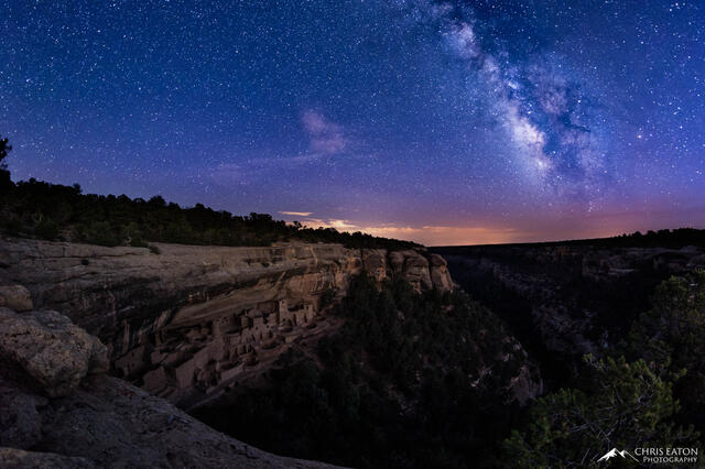 The Milky Way galaxy rises above Cliff Palace in Mesa Verde National Park.