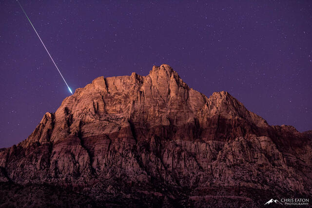 A meteor explodes over Mt. Wilson in Red Rock Canyon Natrional Conservation Area outside of Las Vegas, Nevada.