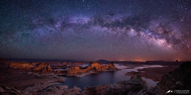 The Milky Way rises in the early morning of spring over Gunsight Butte in Padre Bay on Lake Powell in Glen Canyon National Recreation Area.