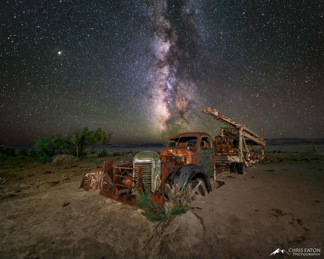 Mars and the Milky Way rise above a long abandoned water drilling truck at Waterwell Oasis along the Hartnet Road as it crosses the North Blue Flats just outsid