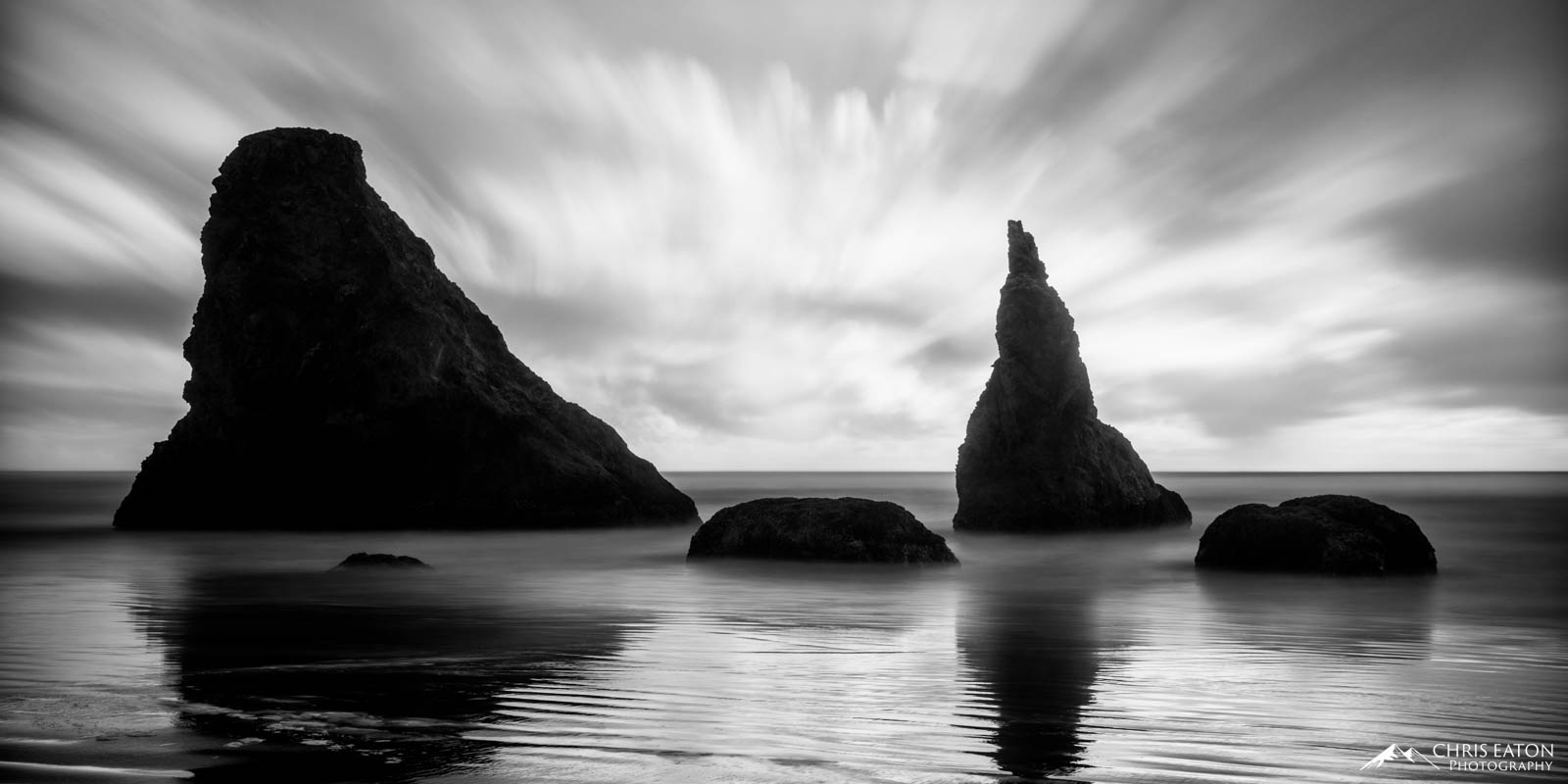 Late evening clouds move in over the Sea Stacks of Bandon Beach.