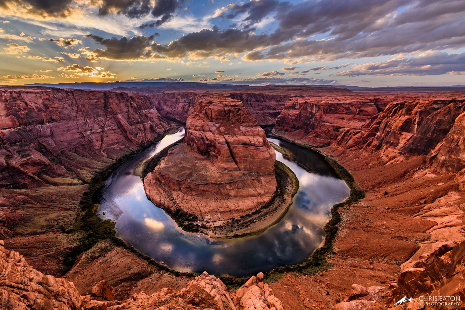 The sun has set and evening begins at Horseshoe Bend on the Colorado River in Glen Canyon National Recreation Area as clouds...