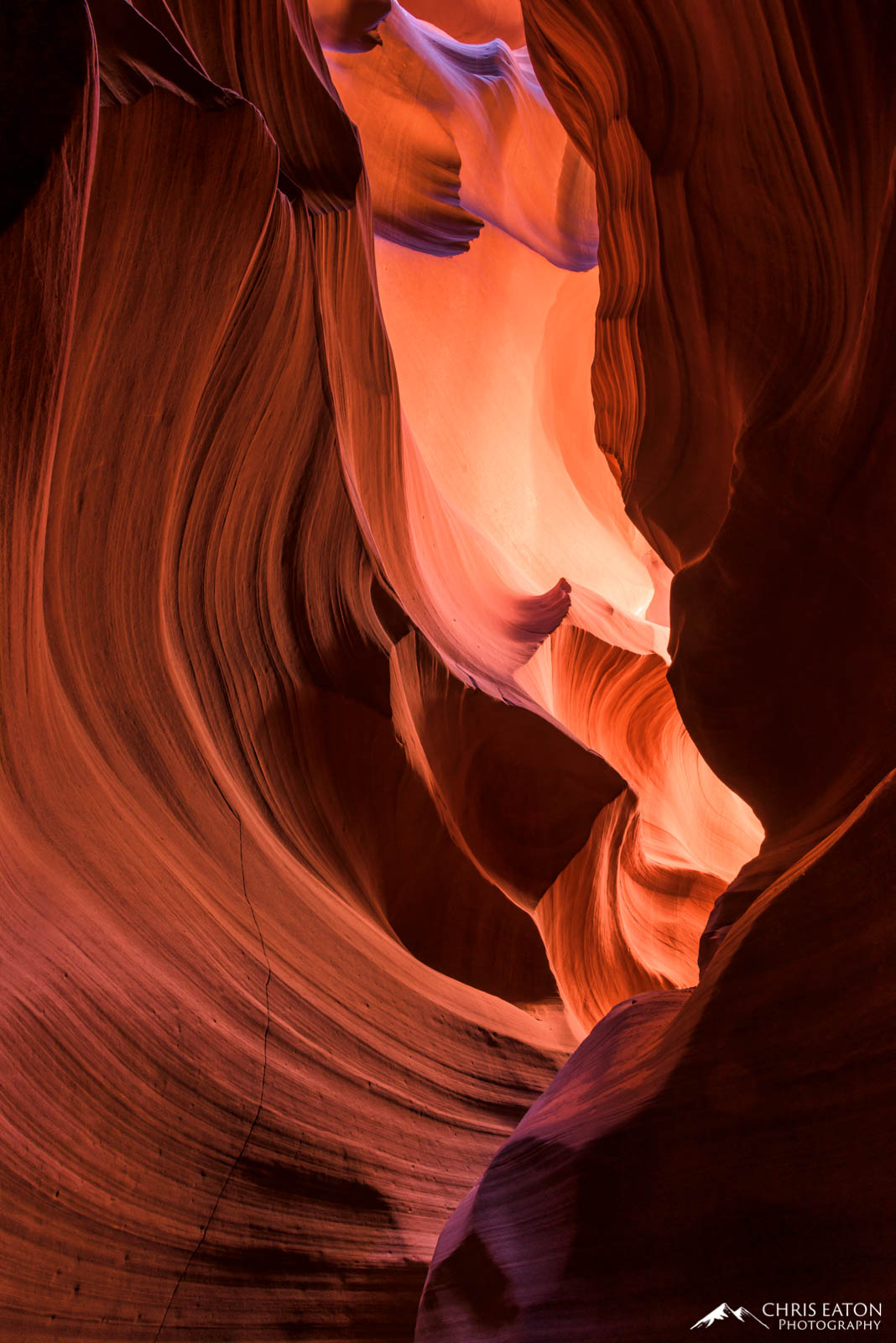 In the back of Upper Antelope Canyon, directly reflected light illuminates the Navajo Sandstone walls creating what is named...