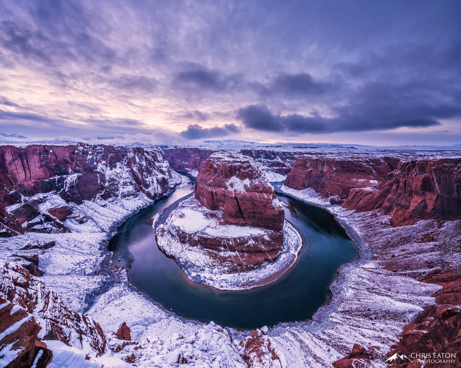 As the storm breaks at sunset, a winter wonderland is revealed in Glen Canyon National Recreation Area at Horseshoe Bend. The...