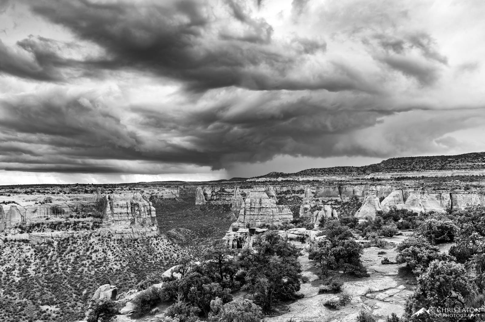 A significant monsson thunderstorm churns over the monuments of Monument Canyon in Colorado National Monument. Shortly after...