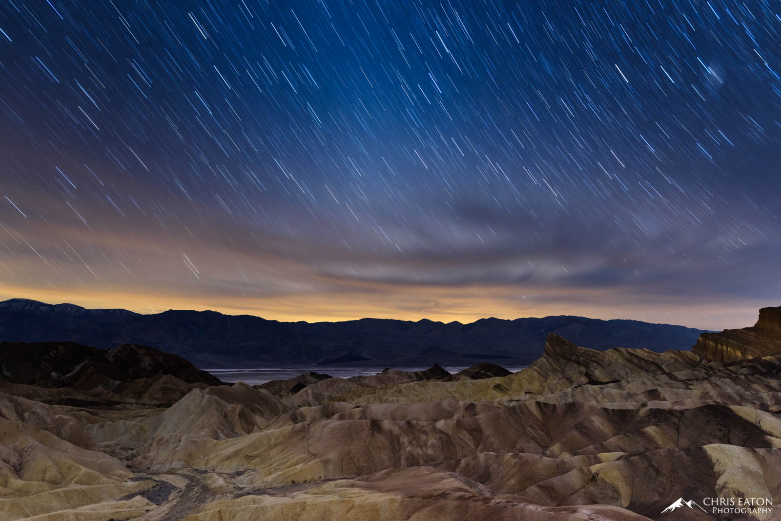 Night Falls on Zabriskie Point Star trails over Manly Beacon at Zabriskie Point in Death Valley National Park.