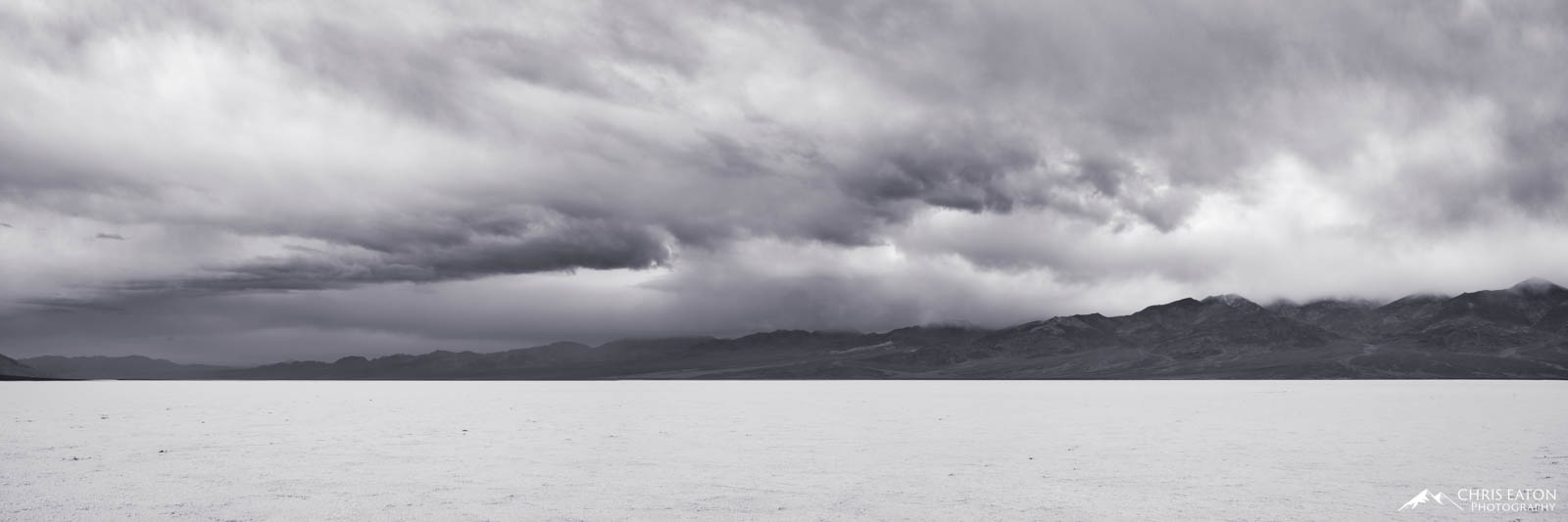 Badwater Storm IV A later winter storm churns over Badwater Basin and the Panamint Range in Death Valley National Park.