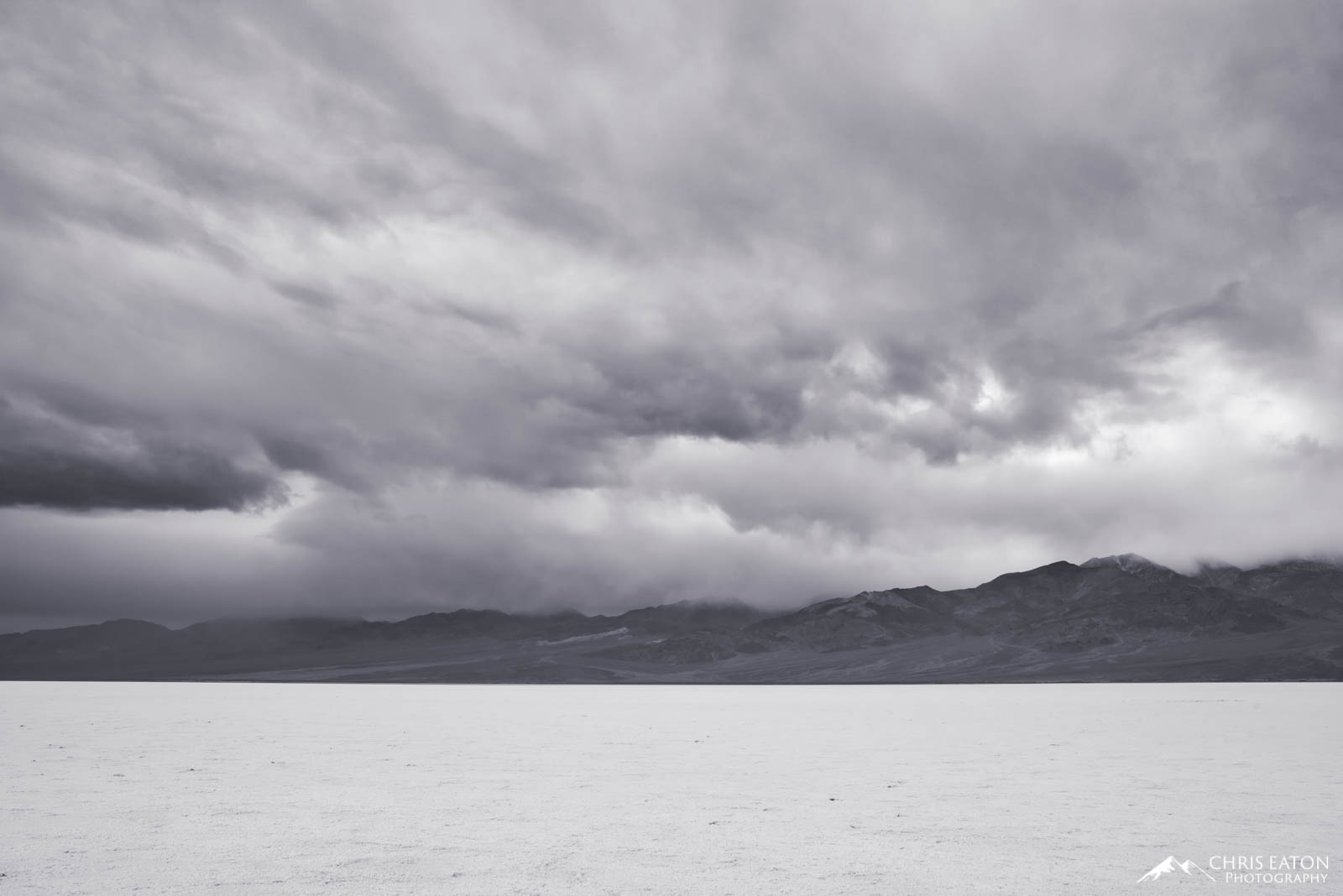 A later winter storm churns over Badwater Basin and the Panamint Range in Death Valley National Park.