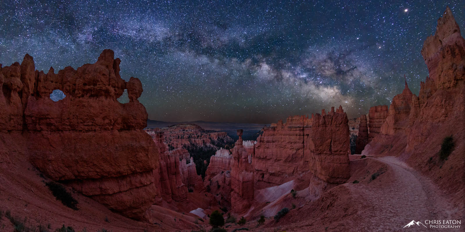 Our Milky Way galaxy arches over the Navajo Loop Trail in the amphitheater of Bryce Canyon National Park.