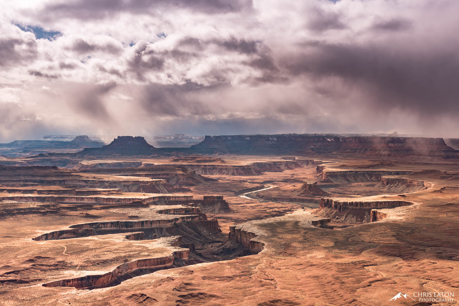 An unsettled airmass creates a winter storm that rakes across the White Rim and Green River in Canyonlands National Park.