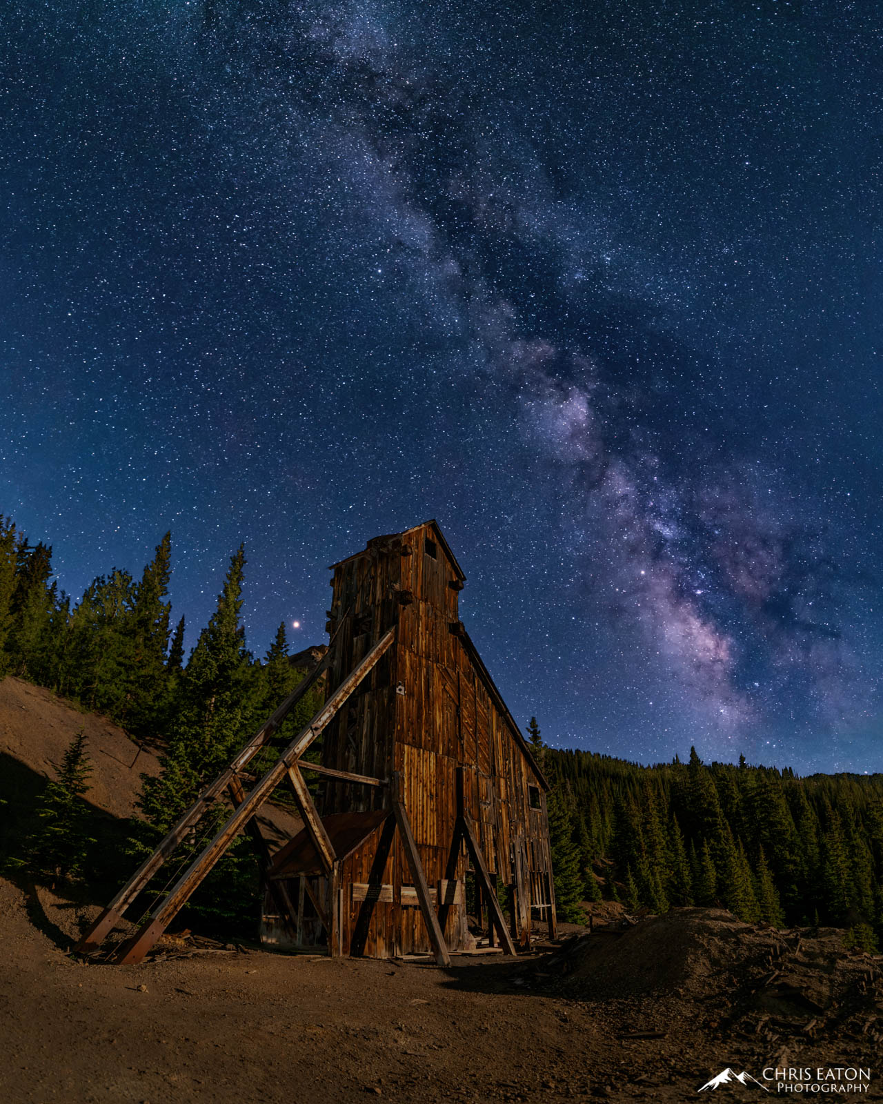 The planet Mars and The Milky Way rise above Yankee Girl Mine.