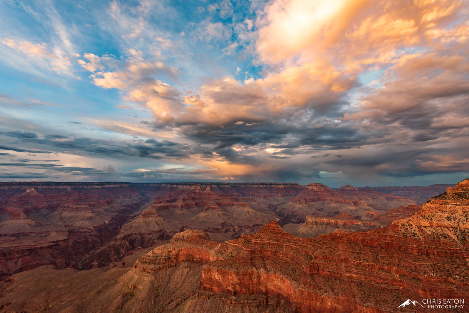 The unsettled atmosphere of a monsoon evening over Mather Point in Grand Canyon National Park is painted by the last light of...